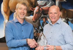 Dr. Larry Hammell, professor of health management, Atlantic Veterinary College, accepts the AVC Atlantic Award of Excellence in Veterinary Medicine and Animal Care Award from Dr. John VanLeeuwen, interim dean, AVC.