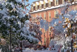 photo of brick building on campus during winter