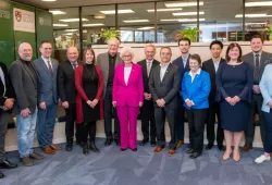 Photos of a large group of people standing in entrepreneurship centre