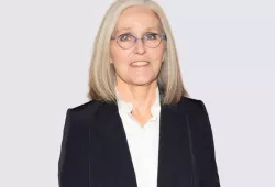 photo of woman wearing glasses against a light background