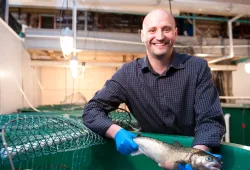 Dr. Mark Fast with a salmon