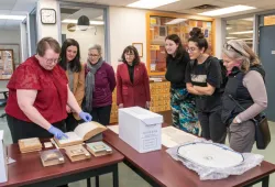 Senators view L.M. Montgomery holdings at Roberton Library.