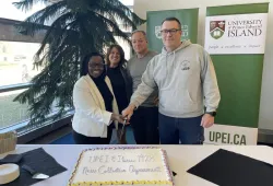 Cutting the cake to celebrate the signing of a new collective agreement between UPEI and IBEW Local 1928 are Dr. Jane Ngobia, UPEI Vice-President, People and Culture; Kelly Drummond, Associate Vice-President, Human Resources; Jim Sponagle, IBEW Local 1928 Business Manager; and Todd MacInnis, IBEW Agent.