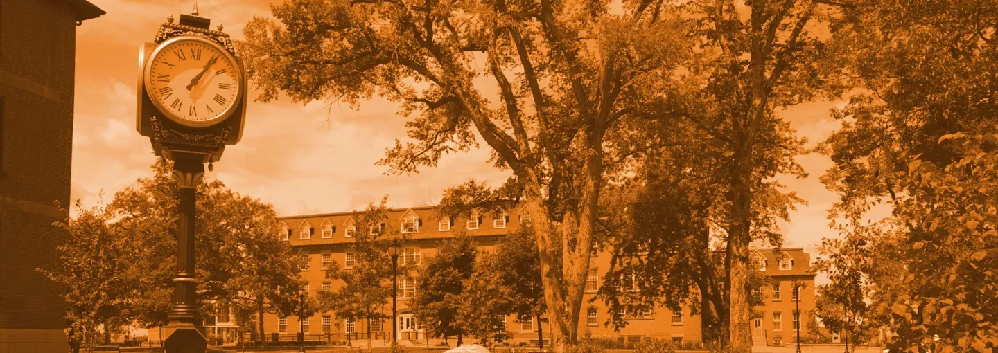 orange-tinted image of UPEI's campus and clock