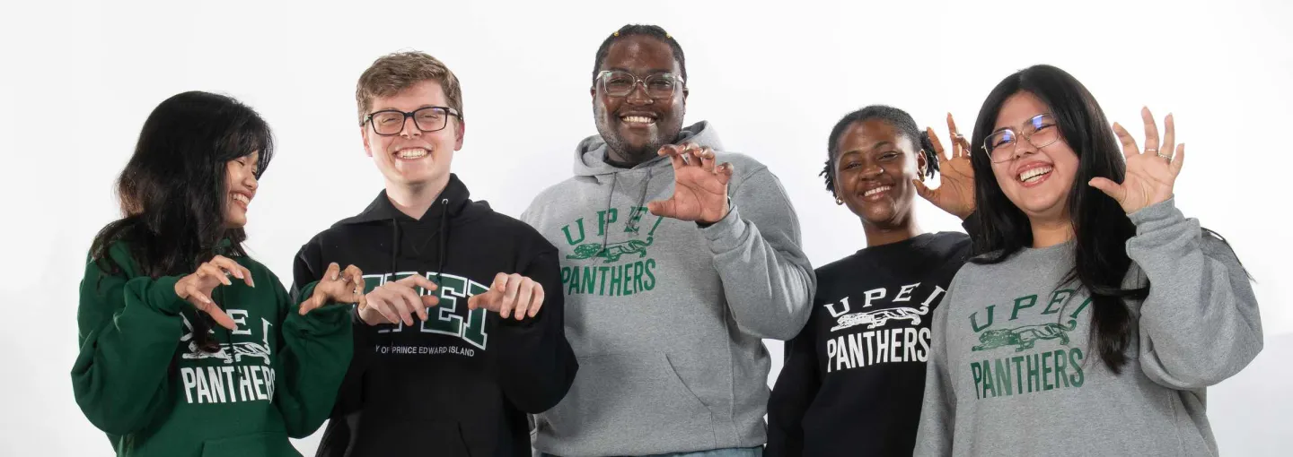 a group of students wearing UPEI-branded clothing