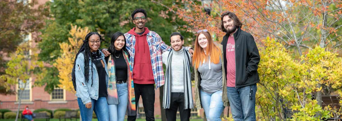 a group of smiling students in the UPEI quad