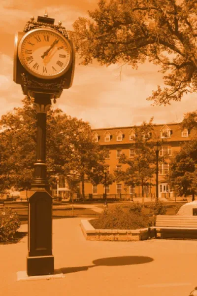 orange-tinted image of UPEI's campus and clock