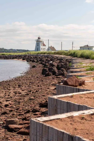 a shoreline with concrete erosion barriers