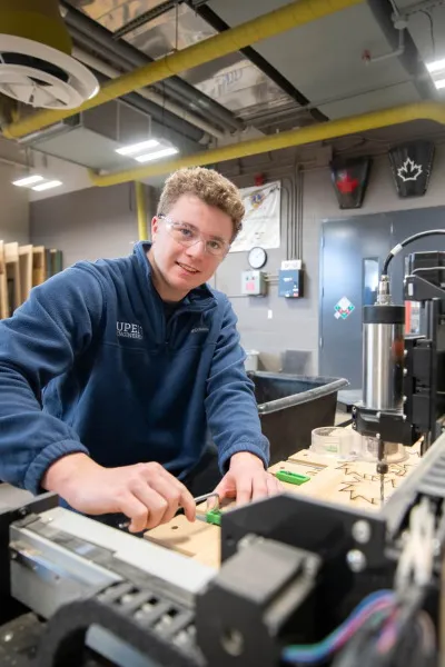 a student wearing safety glasses working in a laboratory