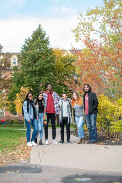 a group of smiling students in the UPEI quad