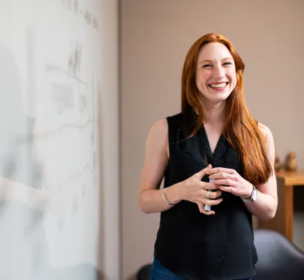 facilitator with red hair smiling 