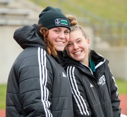 two smiling varsity rugby athletes