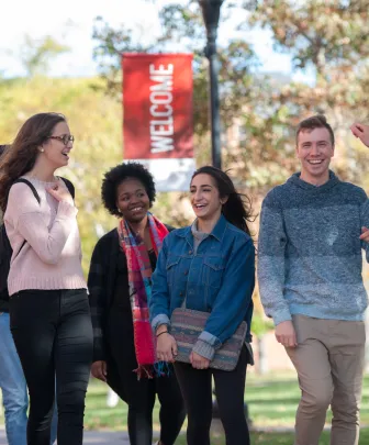 students walk through the UPEI quad