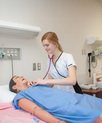 Nursing student in a mock scenario