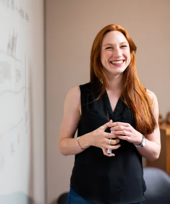 facilitator with red hair smiling 