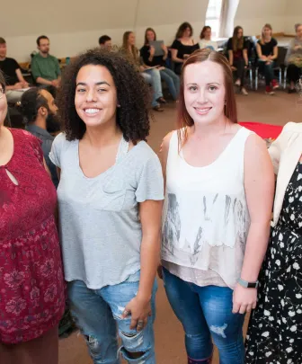 four people leading a group lecture