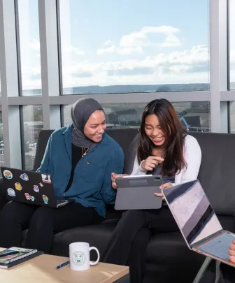 two students working in a UPEI residence lounge