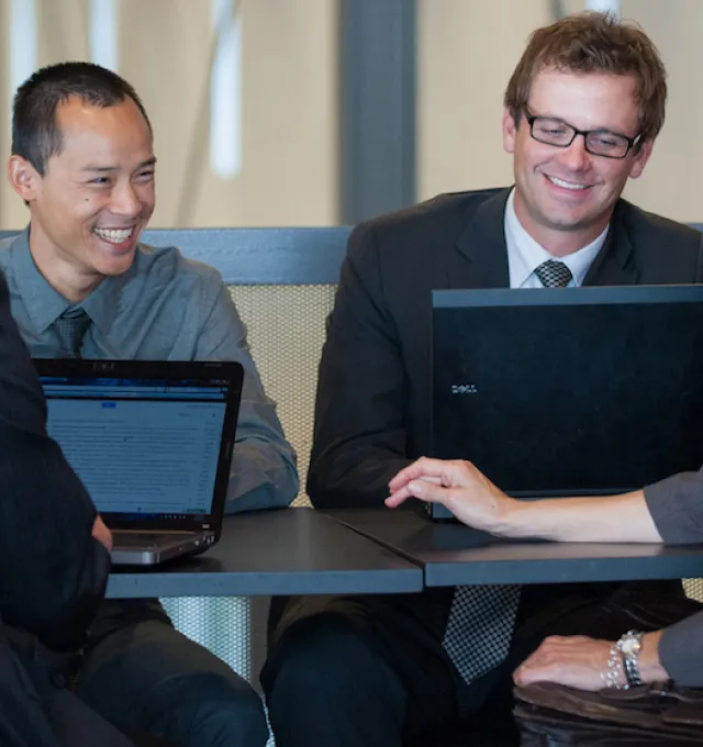 a group of people at a boardroom table