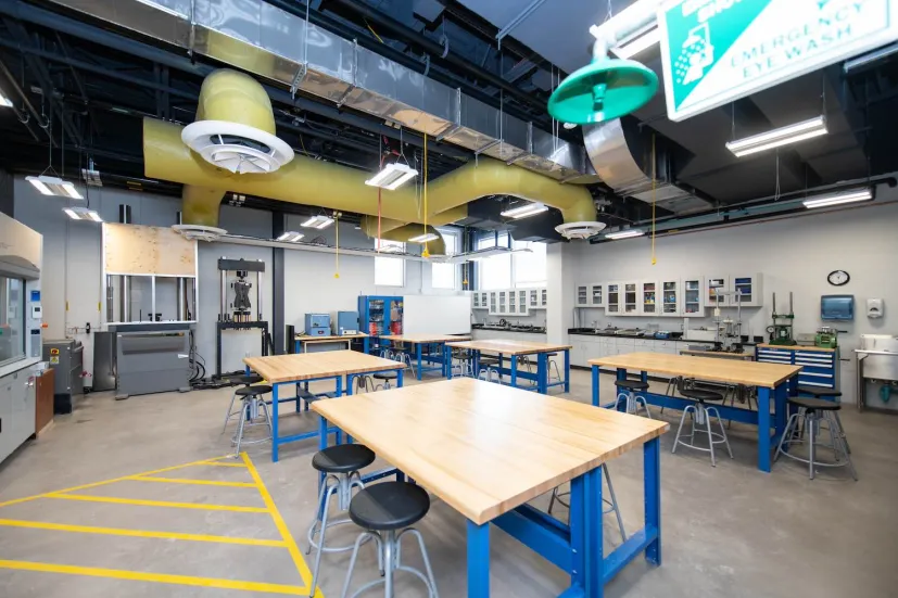 student workstations and blue desks in a shop area in the Faculty of Sustainable Design Engineering building