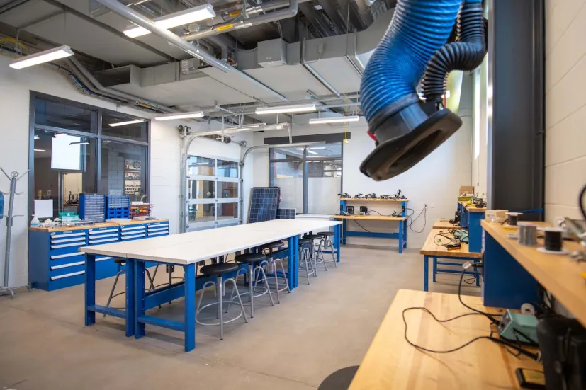 student workstations and blue desks in a shop area in the Faculty of Sustainable Design Engineering building