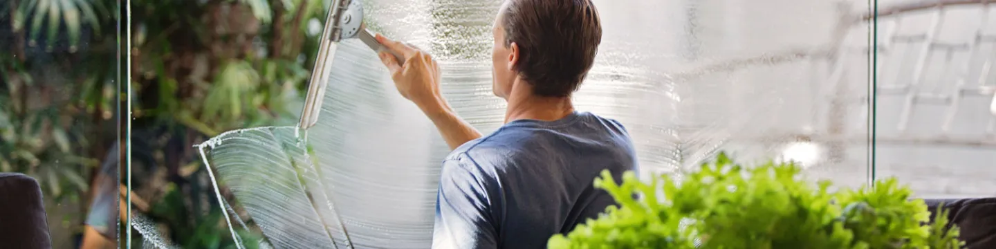 Man Squeegeeing Windows