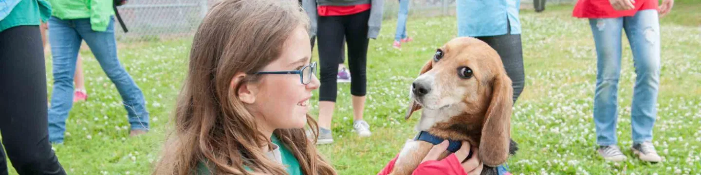 a young vet camp student and a beagle