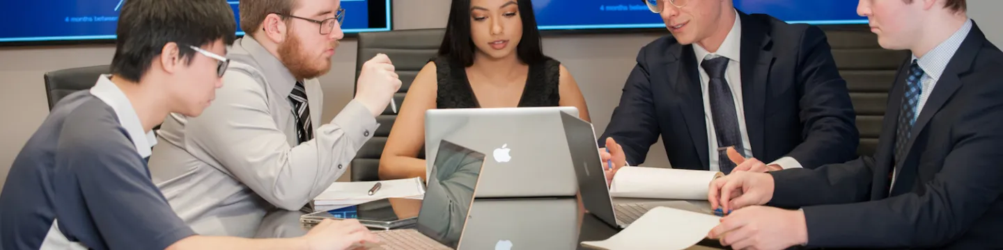 students meeting in a boardroom 