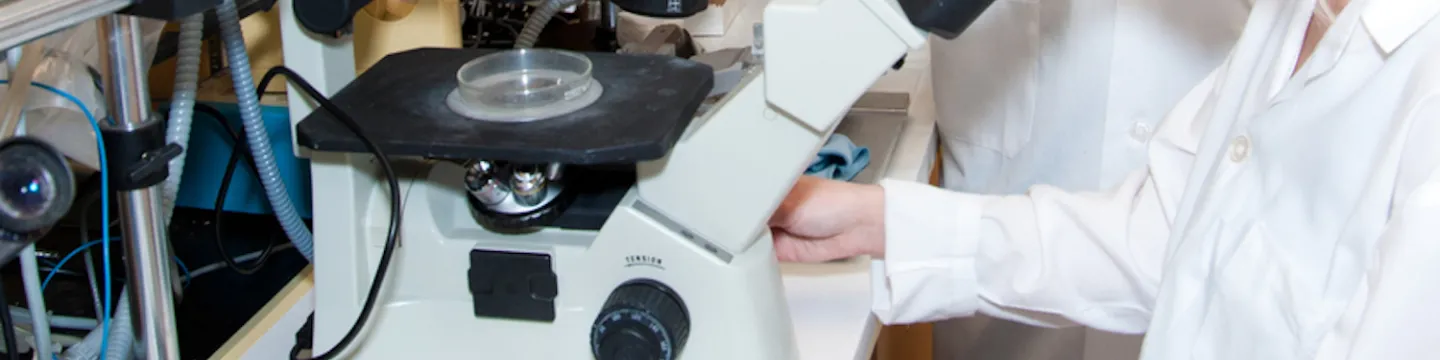 female biologist and microscope