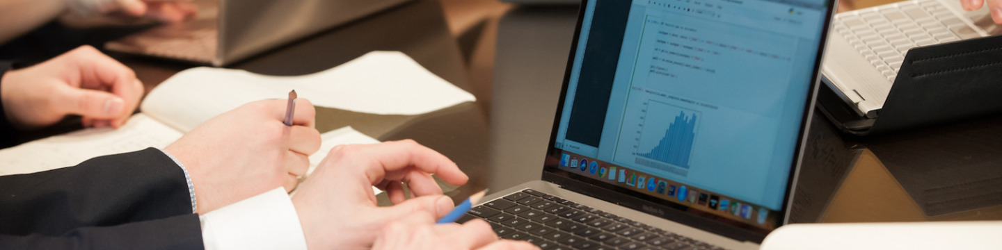 a student typing on a laptop computer