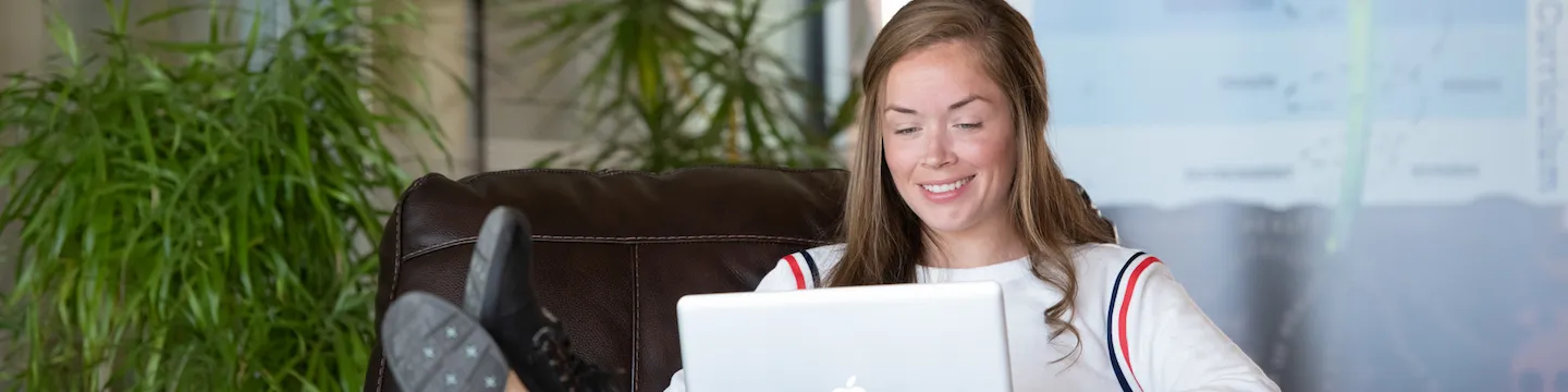 upei nursing graduate shayna conway working on a notebook computer in the health sciences building