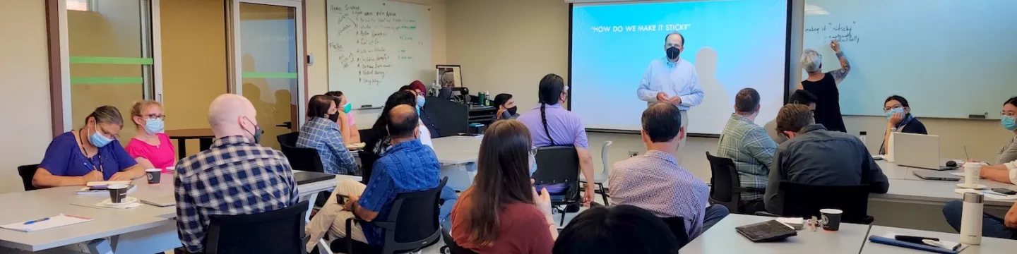 a group of UPEI professors and instructors participating in a training session