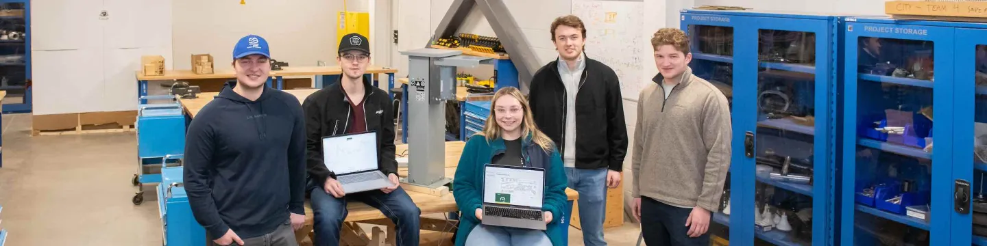 five engineering students working on a project