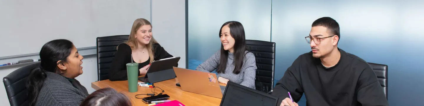 a group of five UPEI business students in McDougall Hall