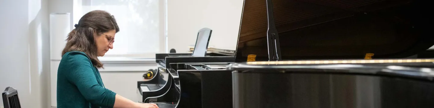Dr. Magdalena von Eccher playing piano in Steel Recital Hall at UPEI