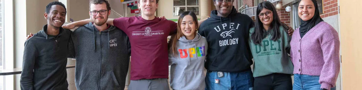 seven students in the W.A. Murphy Student Centre hallway