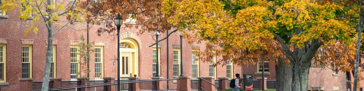 SDU Main Building in fall surrounded by coloured leaves