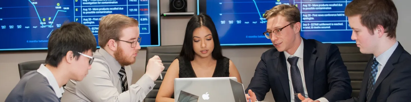math students meeting at boardroom table