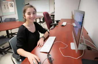 upei math graduate shannan hill working at a computer 