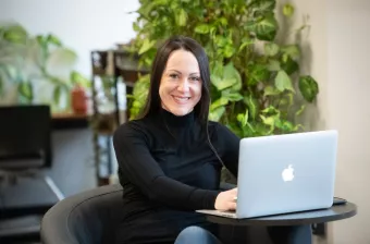 UPEI education graduate Nicole in a Main Building student lounge