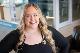 UPEI nursing student Kayla MacLeod in the foyer of the Health Sciences Building