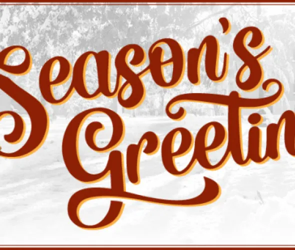decorative image with winter scene, Season's Greetings text, and gold-coloured acorns