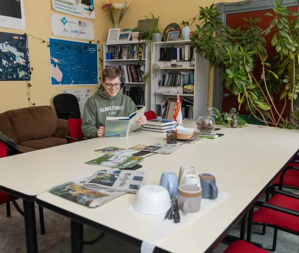 UPEI Master of Arts in Island Studies student Jack Weeks reading a book