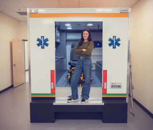 UPEI Paramedicine graduate Kellie MacLeod in a mock ambulance