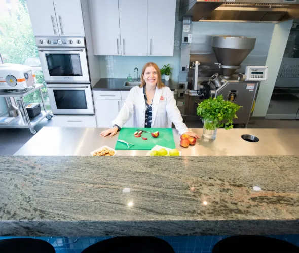 female food product developer in a kitchen