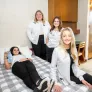 four UPEI nursing students in a UPEI residence room